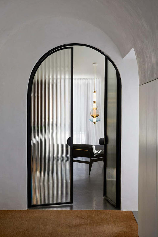 A luxurious Luna style glass pendant light with a gold and clear glass construction, designed for elegant room lighting.