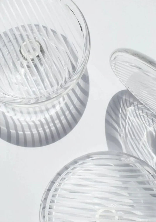 Close-up of Fractal M Style Chandelier crystal and metal details with warm ambient lighting