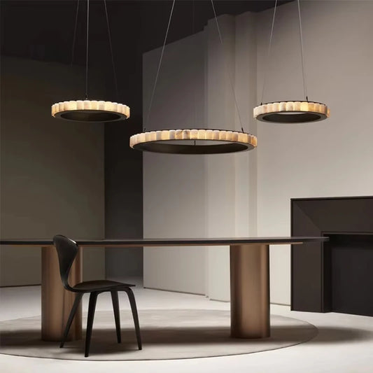 Modern dining table with pendant lights in a minimalistic setting