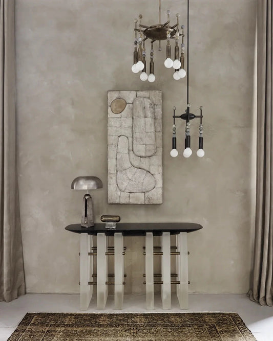 Artistic detail of Talisman 8 chandelier highlighting stone and brass elements