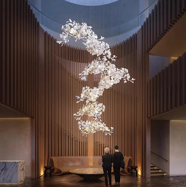 Pair of Gingko leaf chandeliers creating statement lighting in large space