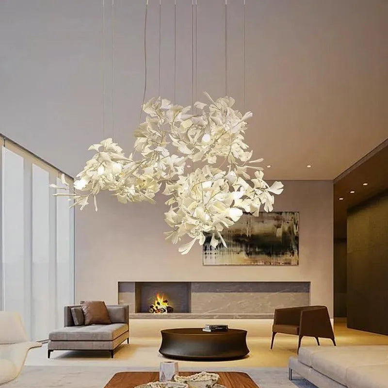 Gingko leaf chandelier illuminated warm ambient lighting in modern living room