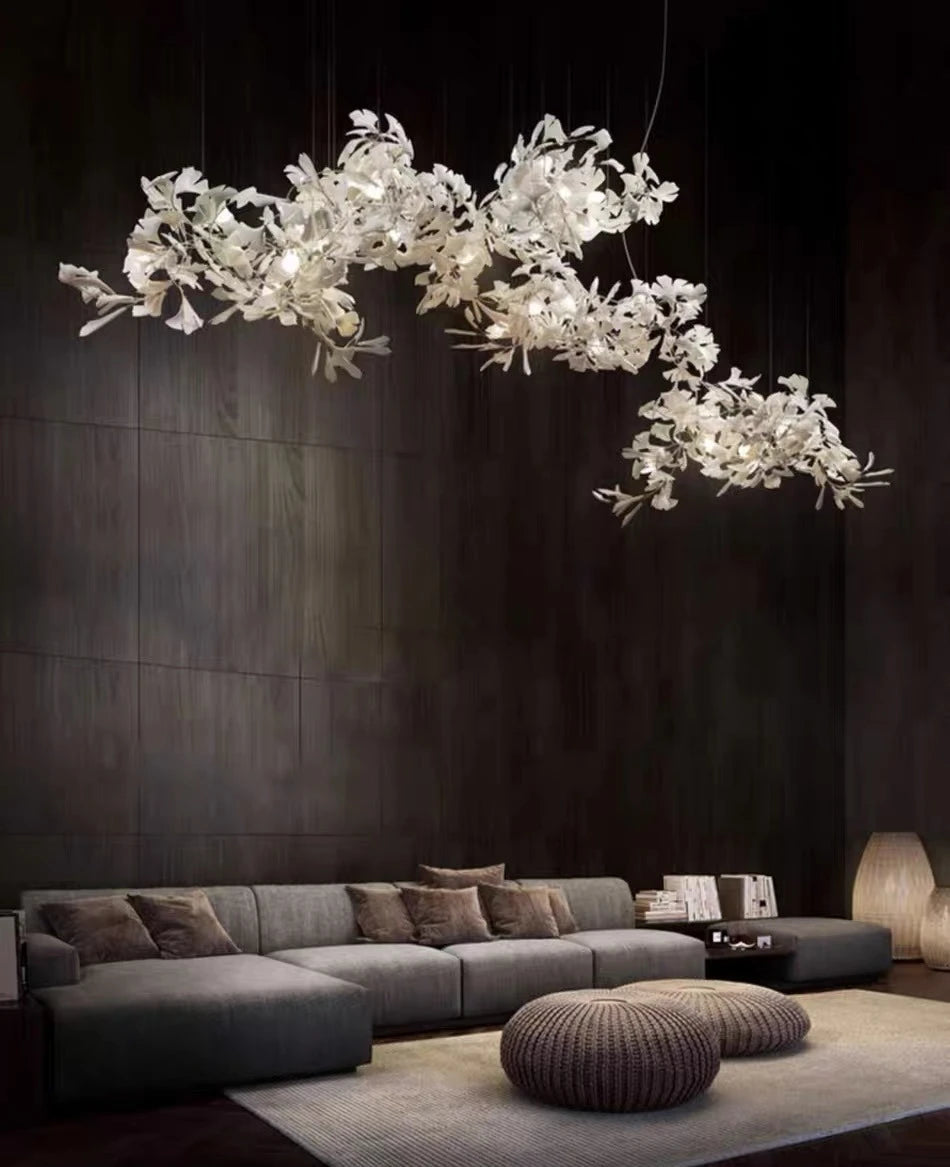 Gingko leaf combination chandelier illuminated warm ambient lighting in luxury living room