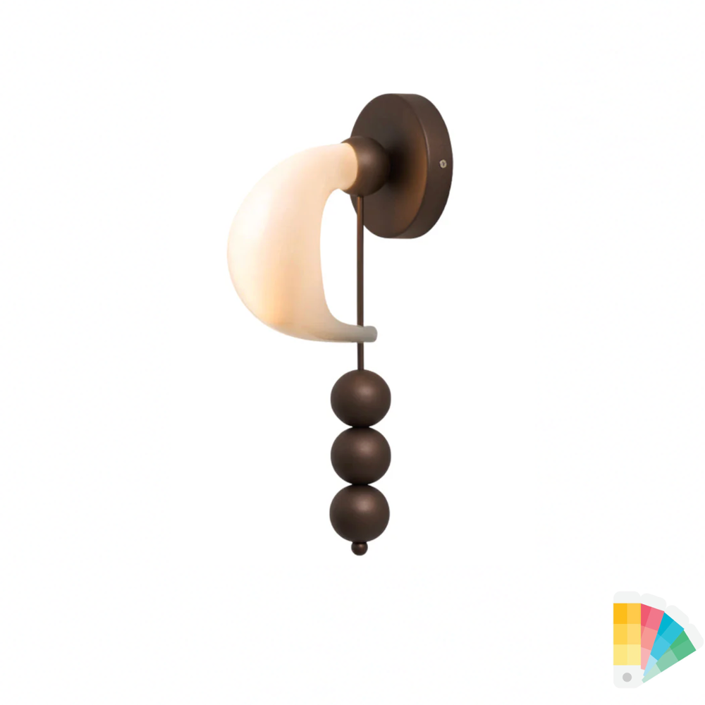 Patty style wall light with sculptural modern design mounted on wall