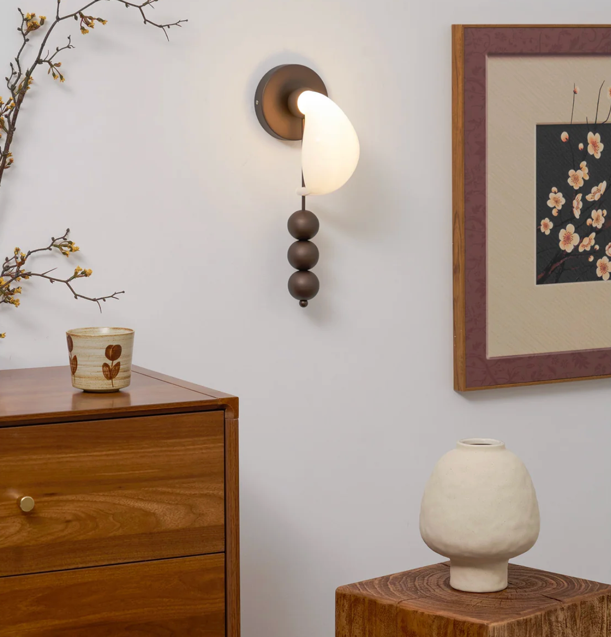 Patty style wall light in modern living room interior setting