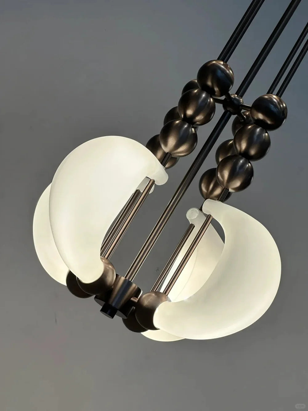 Patty 4-02 style suspension pendant glowing with warm LED illumination