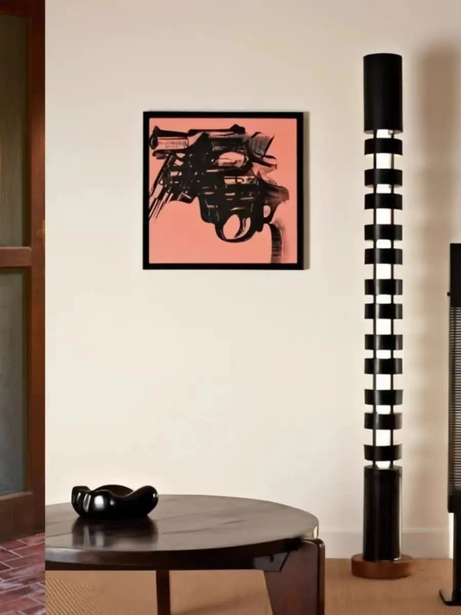 A modern room next to a black-and-white striped floor lamp.