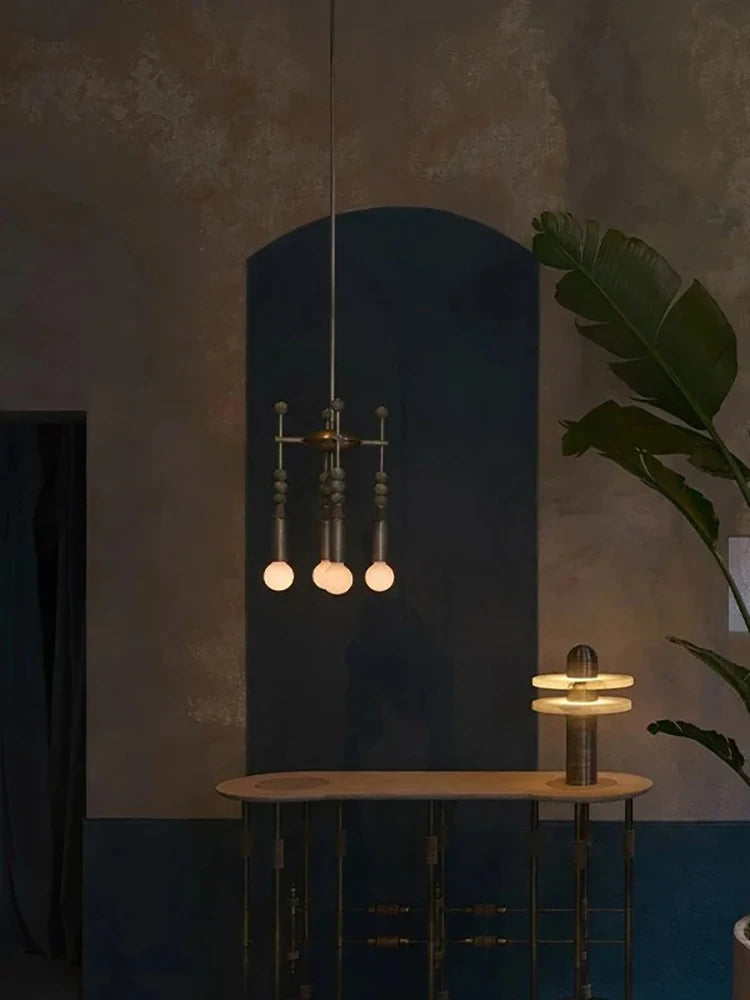 Talisman 4 style chandelier illuminated with warm ambient lighting in living room