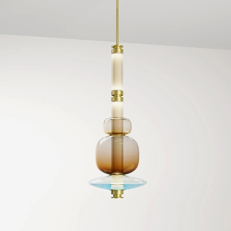 A luxurious Luna style glass pendant light with a gold and clear glass construction, designed for elegant room lighting.