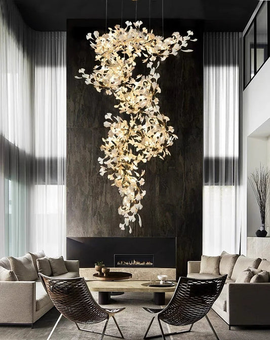 Gingko leaf chandelier illuminated creating warm ambient lighting in living room