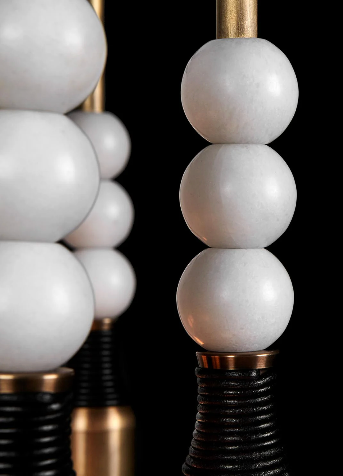 Close up of Talisman 14 chandelier brass details and sculptural design