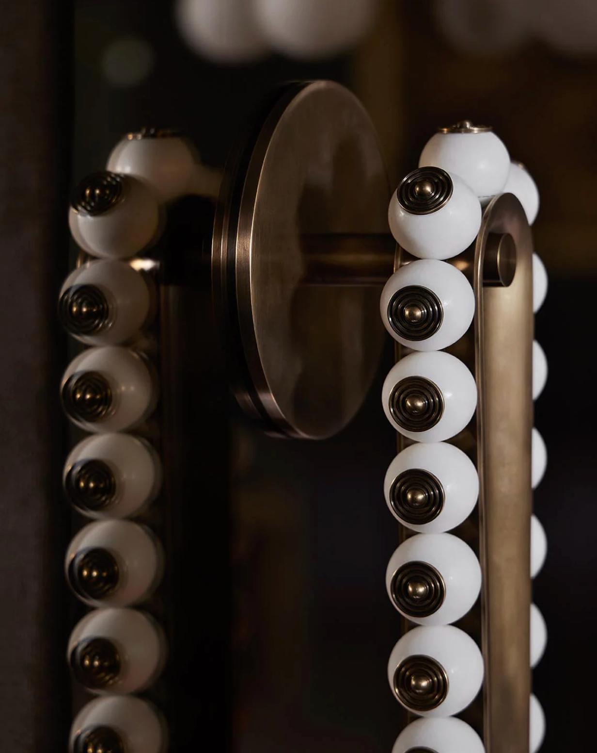 Side view of Talisman Loop style wall light with minimalist architectural form