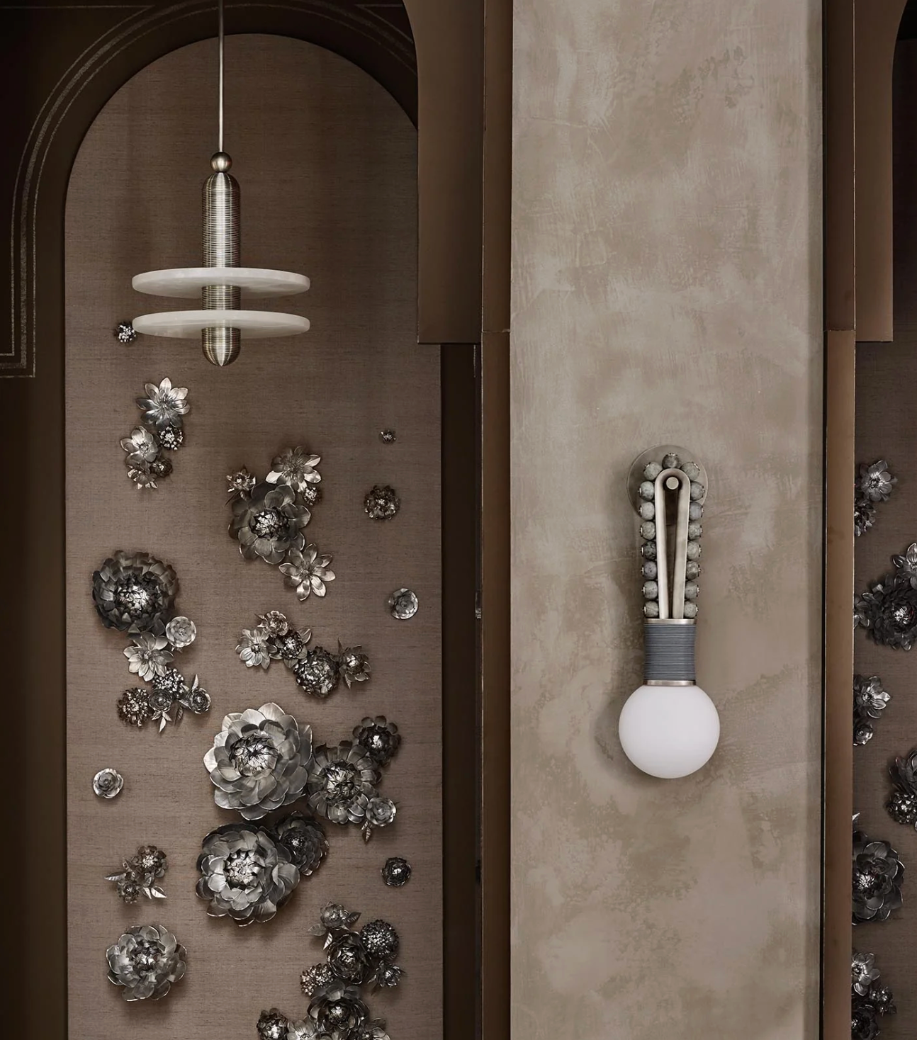 Talisman Loop style wall light creating soft accent lighting in hallway